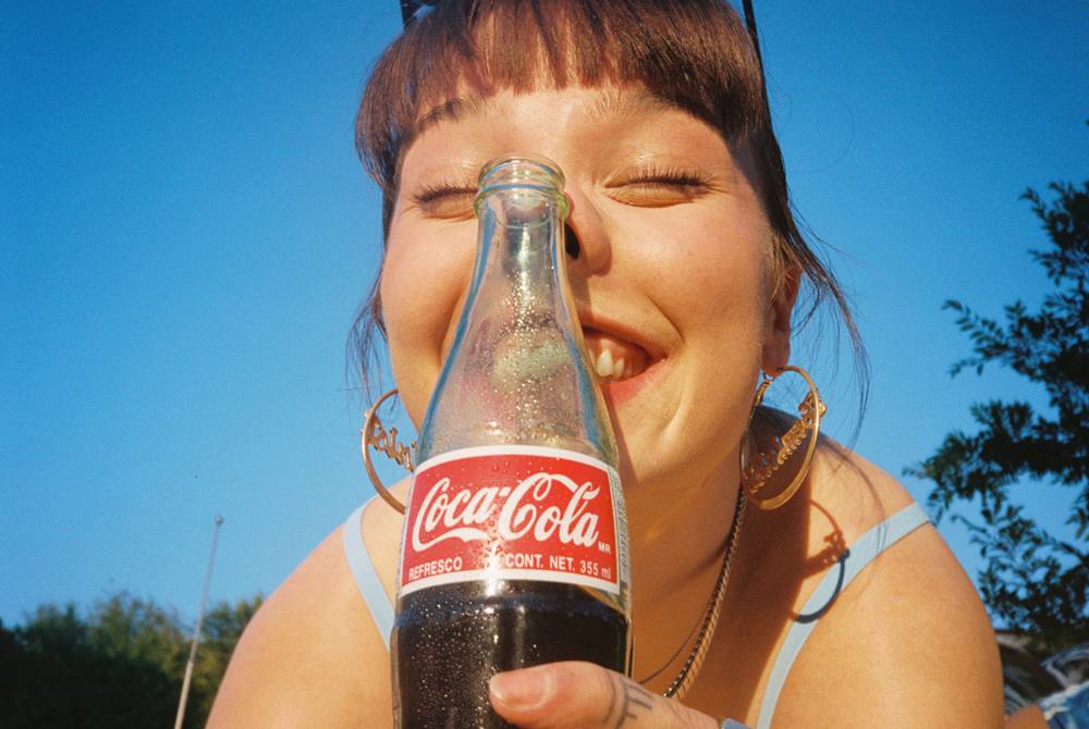 Photo of Goofy faces with Coca Cola