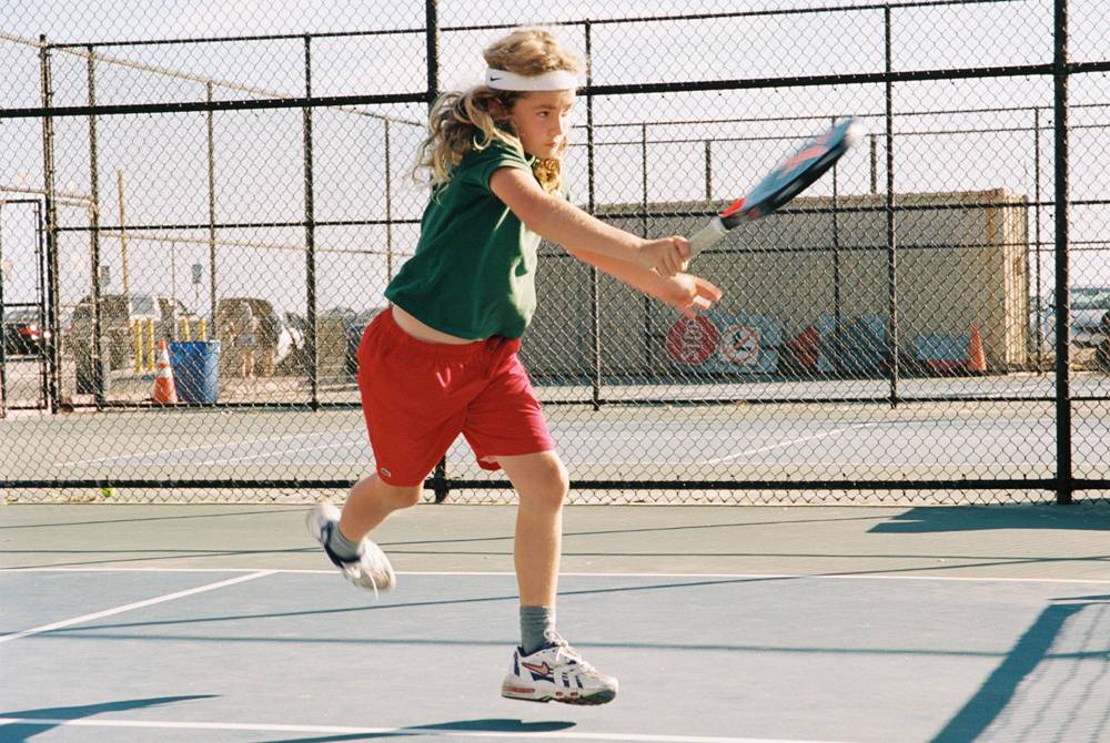 Photo of a Tennis boy in his Nike gear taken by Brit Phelan