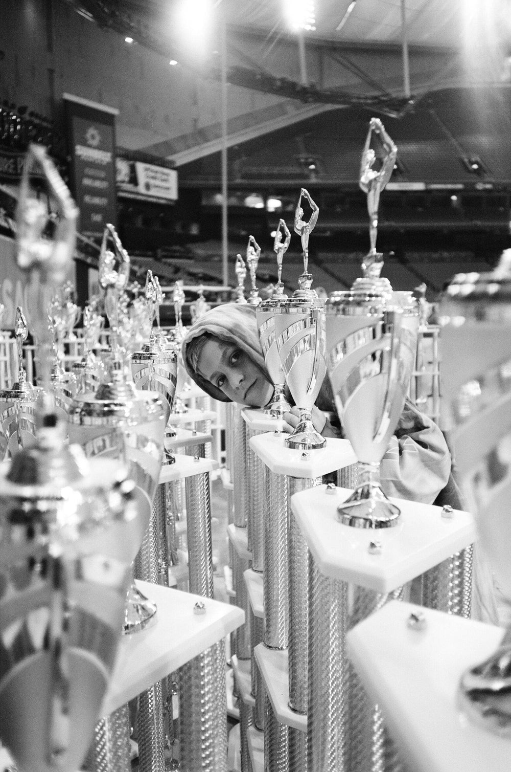  Picture of A boy in his hoodie withhis trophies by Photographer Brit Phelan